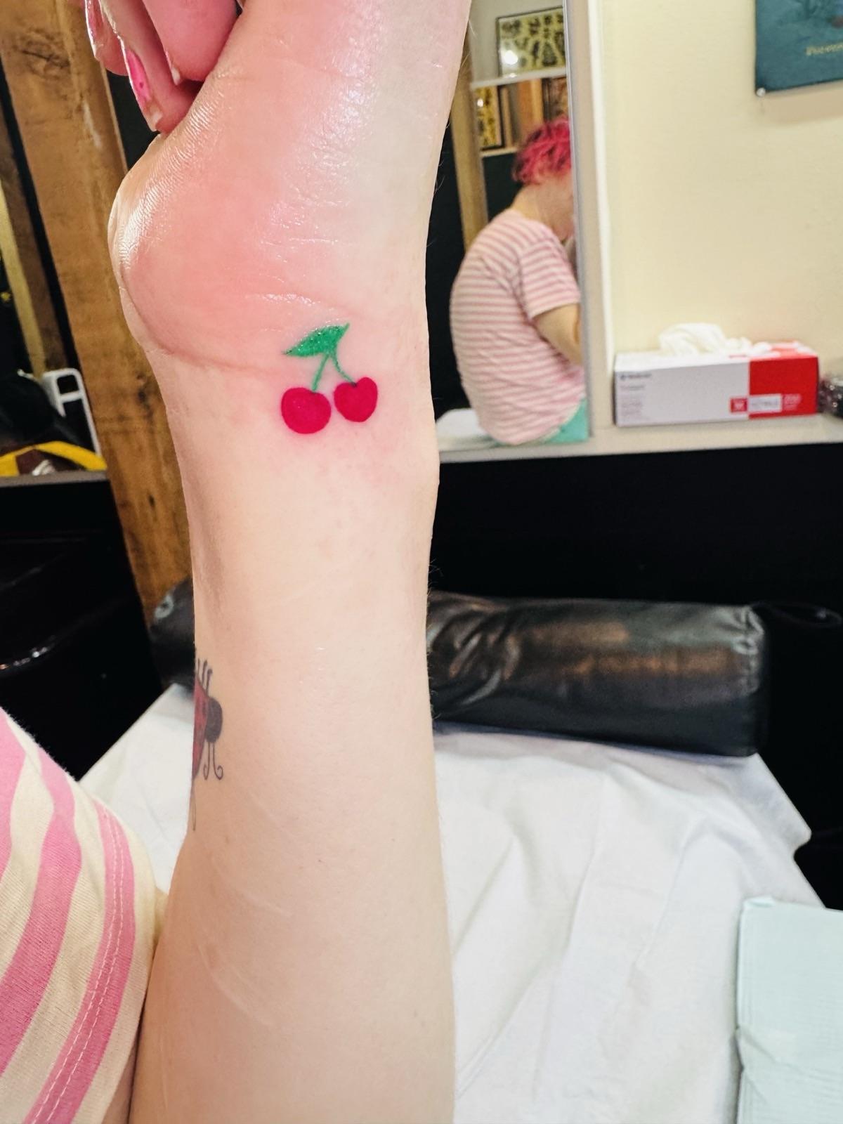 cherry tattoo on my left wrist.
