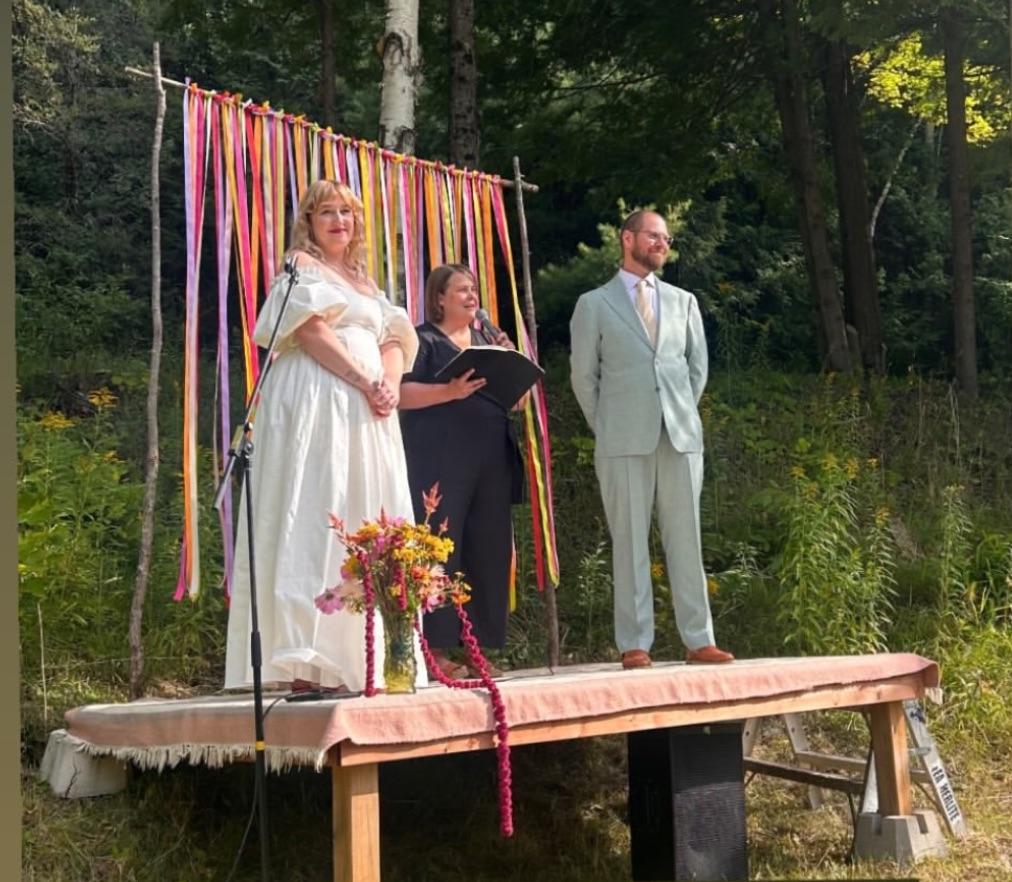the beautiful pair on a colourful podium becoming married