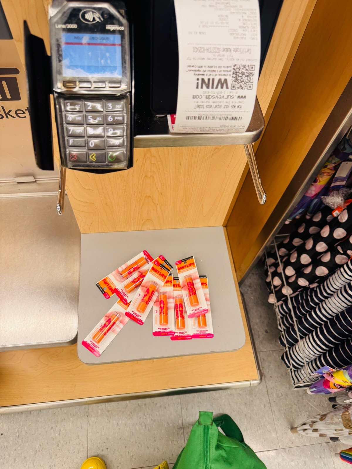 15 or so baby lips cherry me on the bag area of a self-checkout